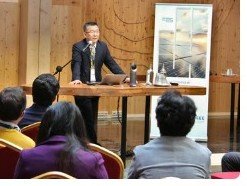Speaker presenting at a previous FES conference